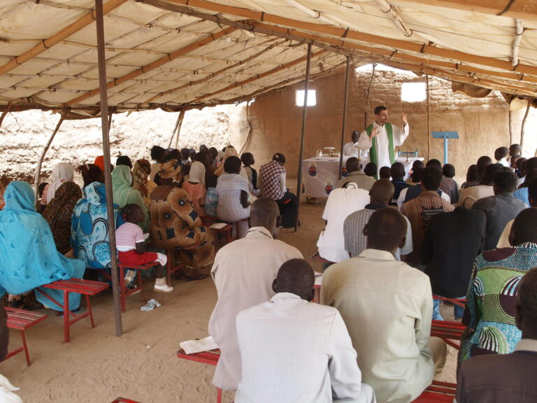 Father Jorge Naranjo, Combonian priest with his community in Sudan